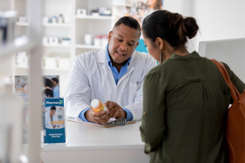 Pharmacist giving advice to a patient.