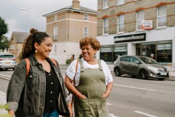 Two women walking down the street